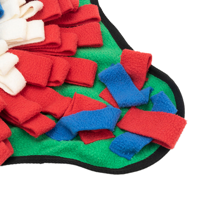 Pet using snuffle mat for treat hunting